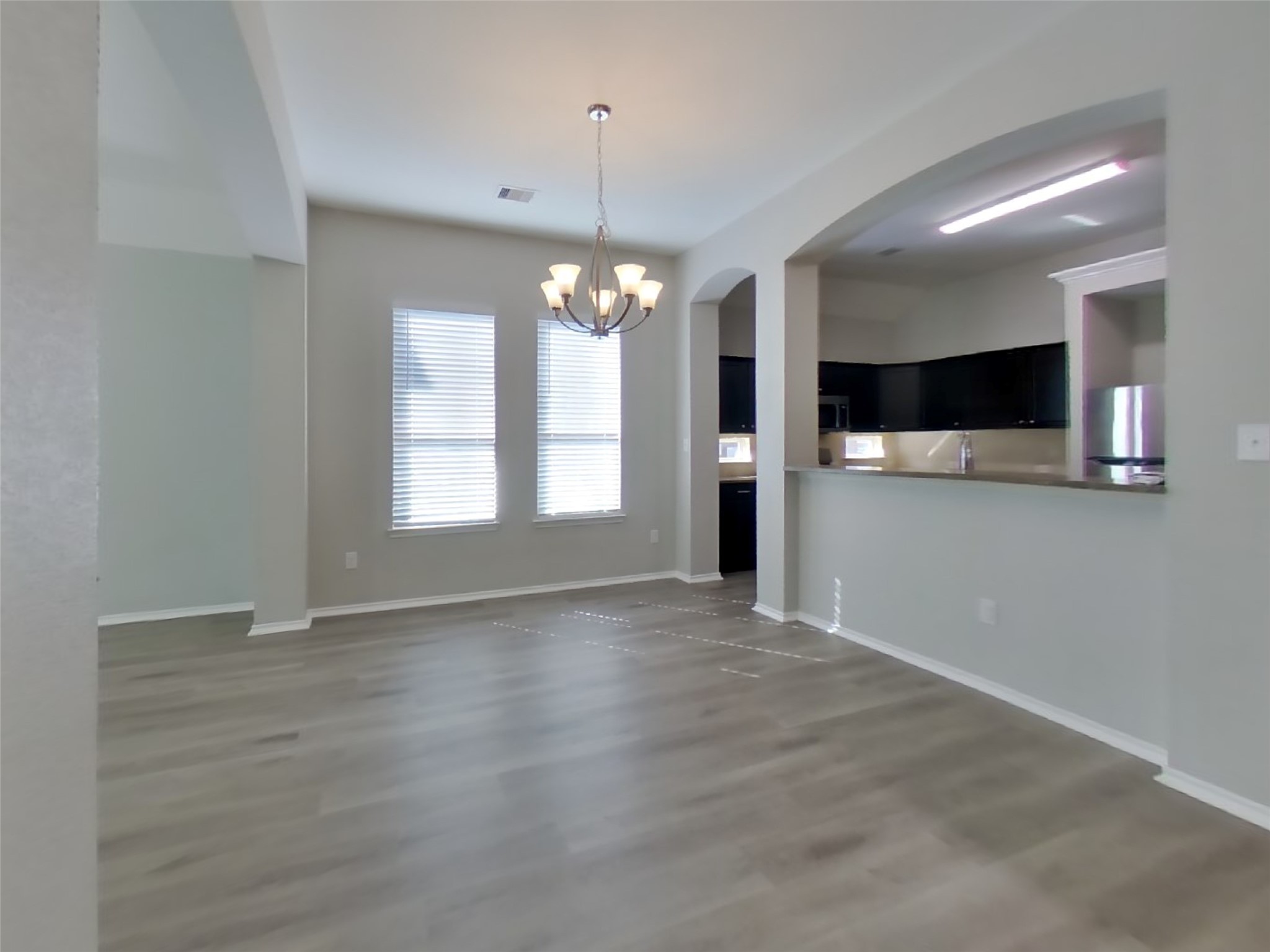 1937 Briar Grove Drive Conroe, TX 77301 - Photo 5 of 18 a view of an empty room with window and kitchen view