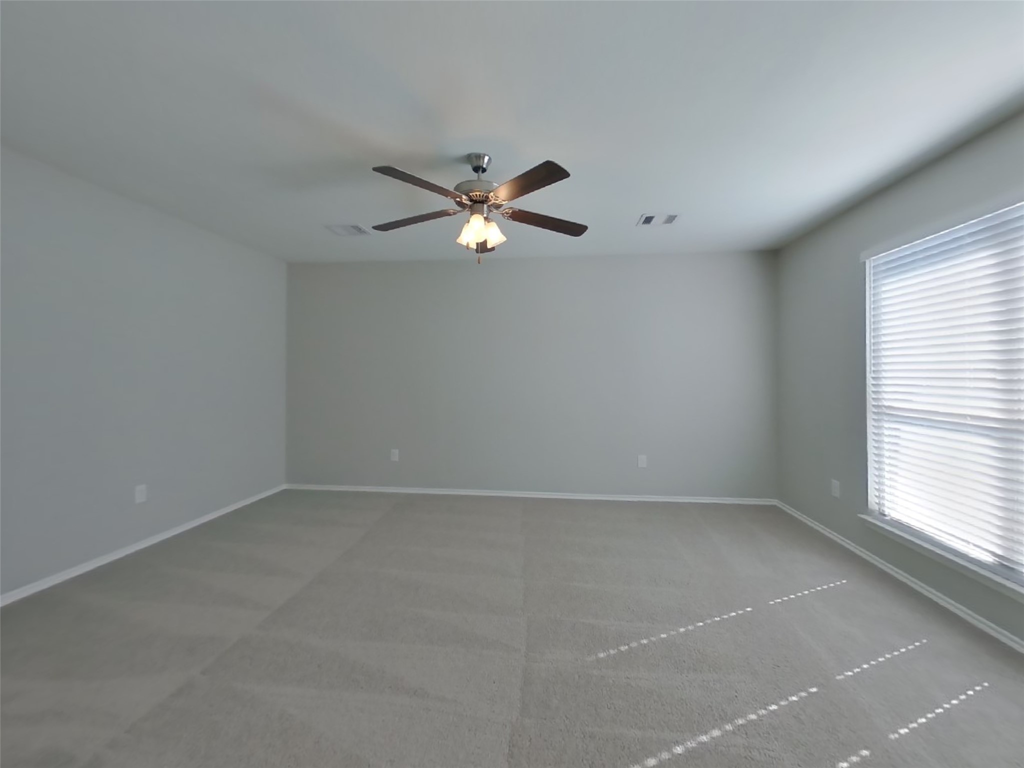 1937 Briar Grove Drive Conroe, TX 77301 - Photo 10 of 18 an empty room with a window and a fan