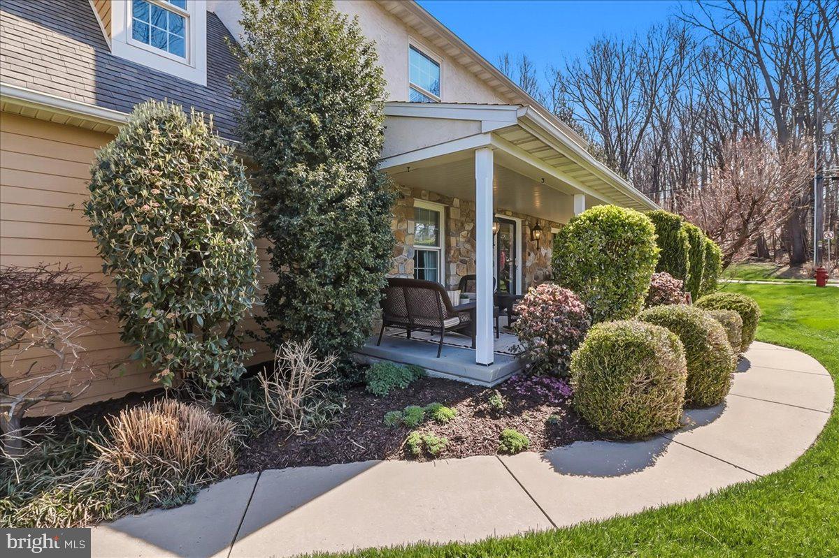 a view of a backyard with garden and patio