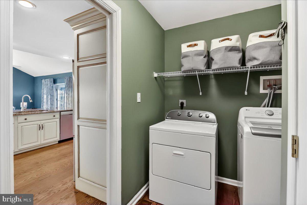 2 Parkside Drive Elverson, PA 19520 - Photo 11 of 39 a view of washer and dryer with wooden floor