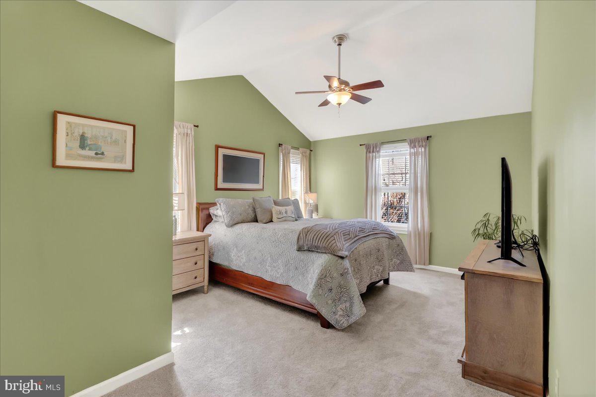 2 Parkside Drive Elverson, PA 19520 - Photo 13 of 39 a spacious bedroom with a bed wooden floor and window