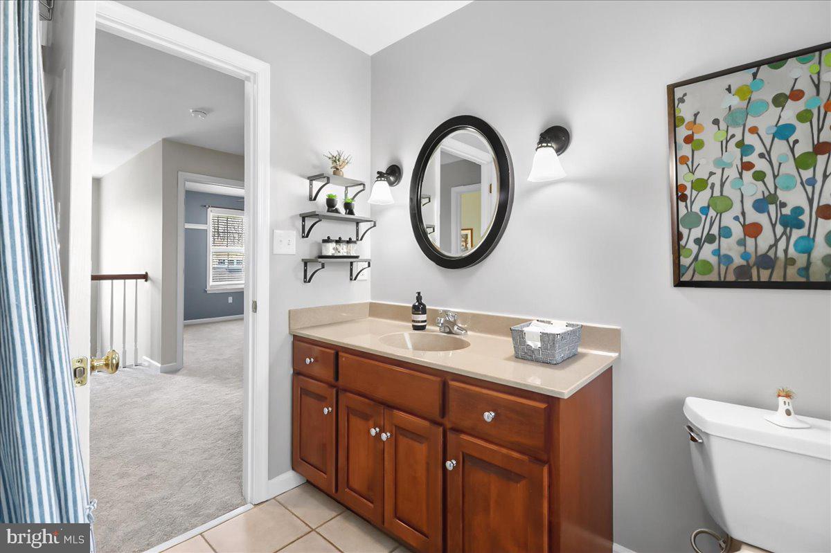 2 Parkside Drive Elverson, PA 19520 - Photo 20 of 39 a bathroom with a toilet a sink and a mirror