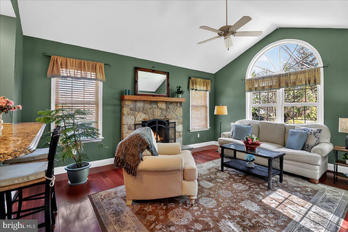 2 Parkside Drive Elverson, PA 19520 - Photo 7 of 39 a living room with furniture a fireplace and a large window