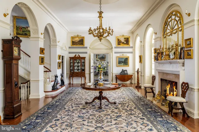 a dining room with wooden floor and a table
