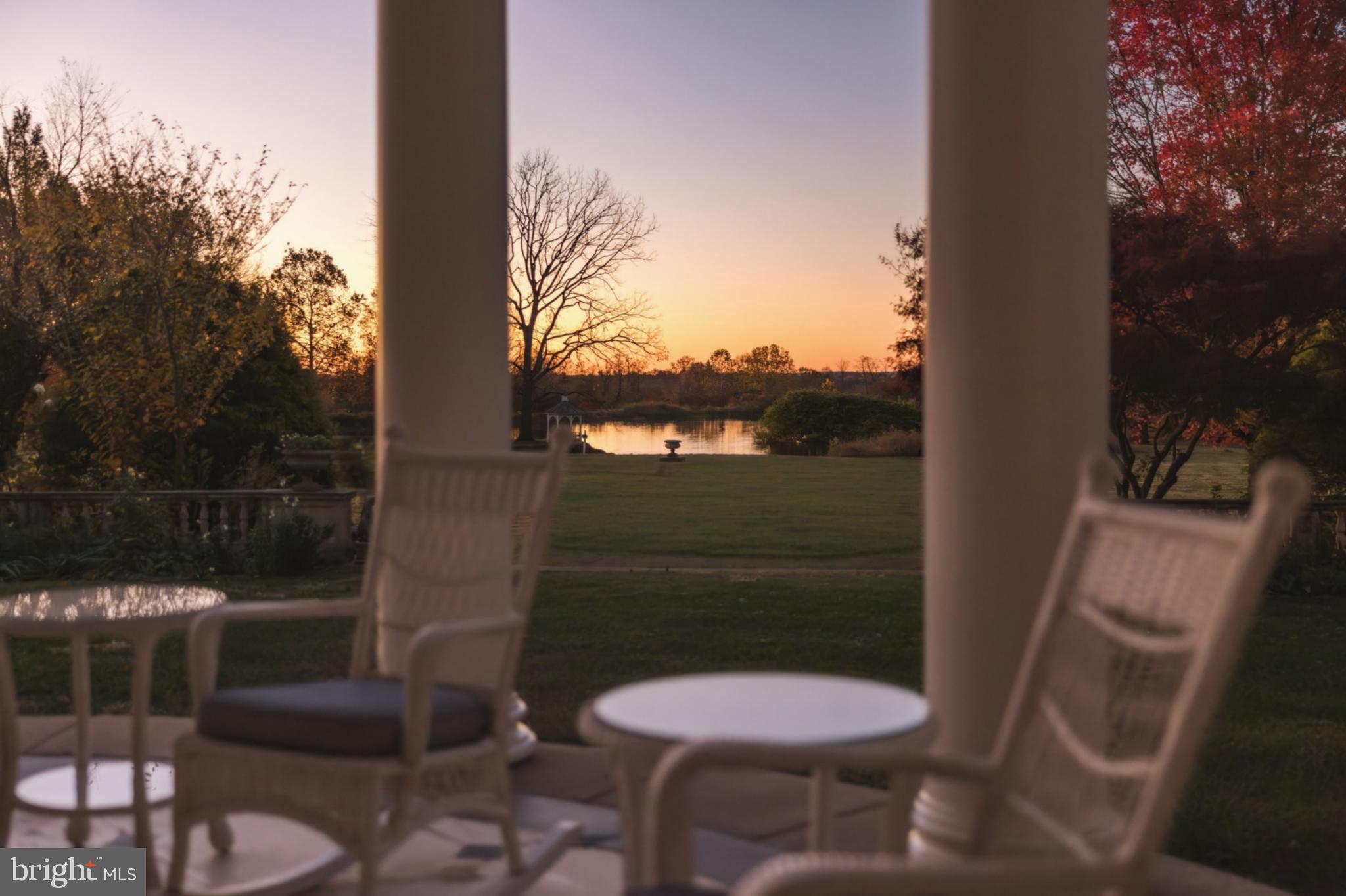 21846 Trappe Road Upperville, VA 20184 - Photo 16 of 50 a view of a balcony with chair and potted plants