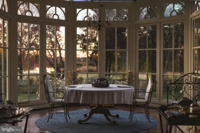 a bed room with a bed and a chandelier