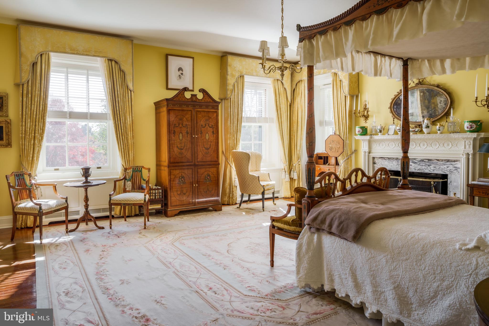 21846 Trappe Road Upperville, VA 20184 - Photo 30 of 50 a bed room with a bed and a chandelier