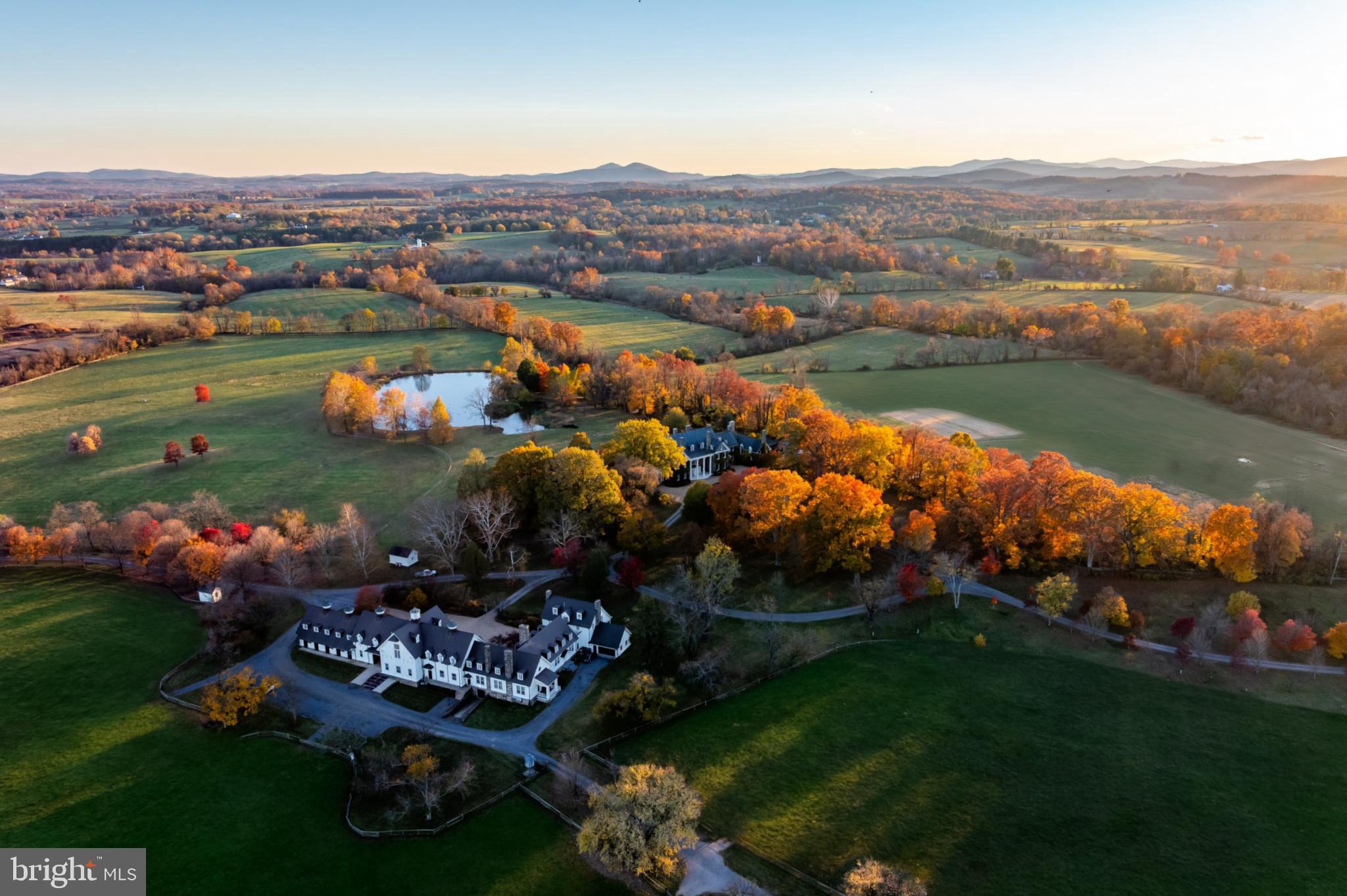 21846 Trappe Road Upperville, VA 20184 - Photo 3 of 50 an aerial view of a house with a garden and lake view