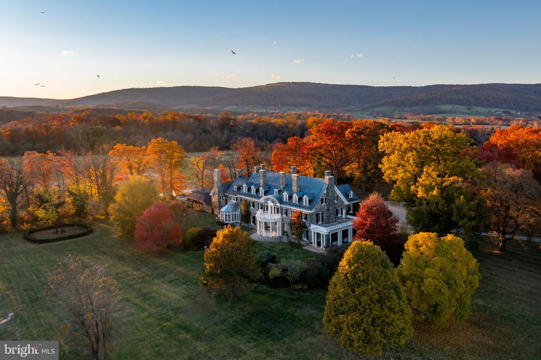 21846 Trappe Road Upperville, VA 20184 - Photo 4 of 50 a view of a house with a yard and mountain view