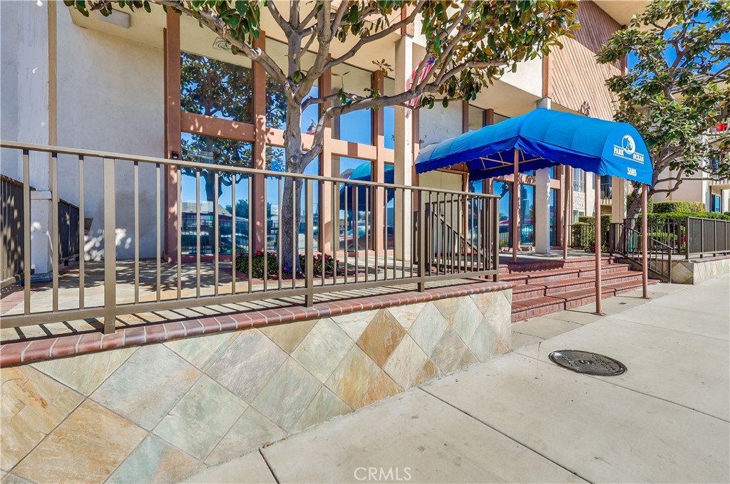 5585 Pacific Coast Highway, Unit 140 Long Beach, CA 90804 - Photo 2 of 47 a view of a house with a yard and sitting area