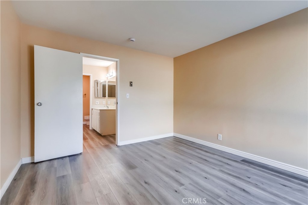5585 Pacific Coast Highway, Unit 140 Long Beach, CA 90804 - Photo 22 of 47 a view of wooden floor in an empty room