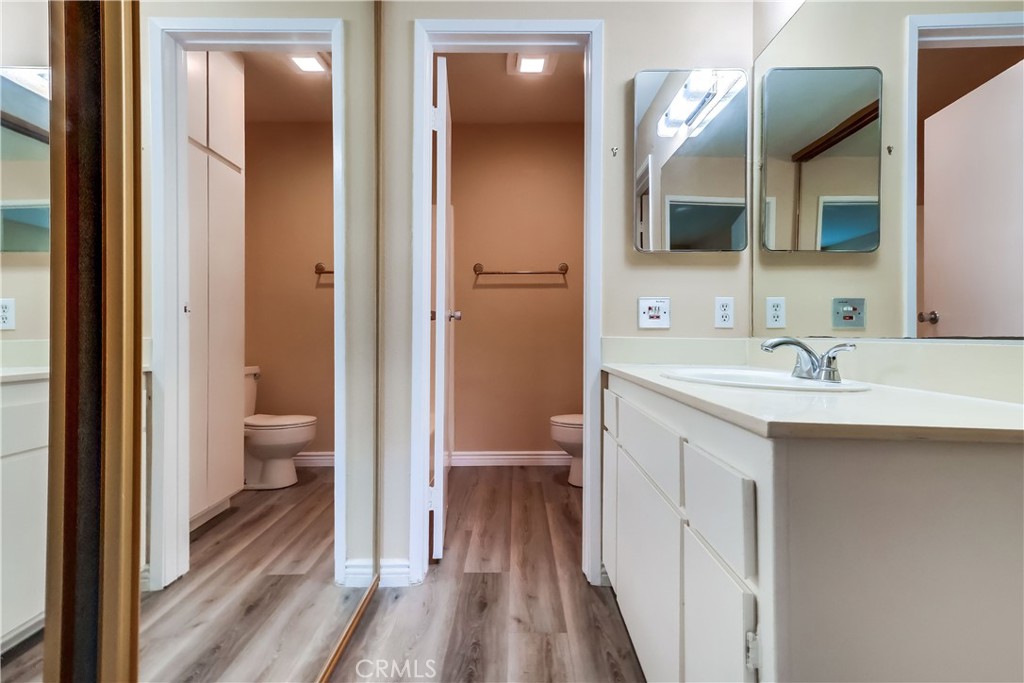 5585 Pacific Coast Highway, Unit 140 Long Beach, CA 90804 - Photo 24 of 47 a bathroom with a sink a toilet and shower