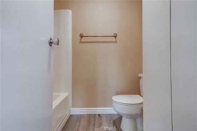 a bathroom with a toilet and a vanity