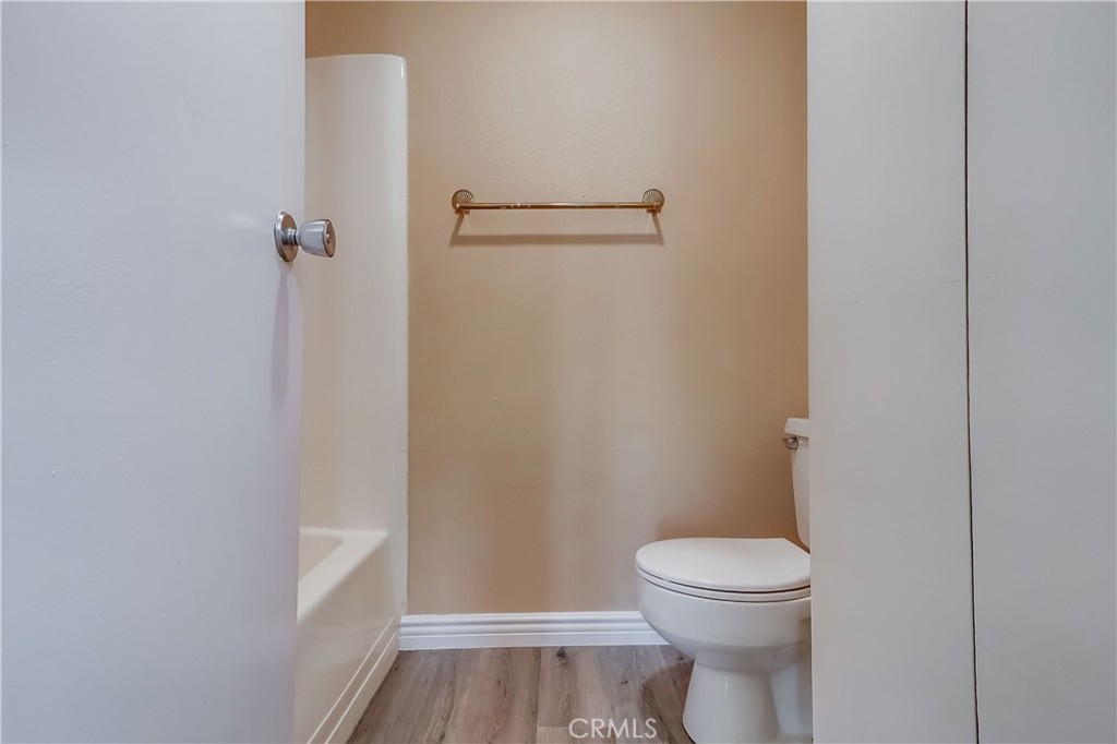 5585 Pacific Coast Highway, Unit 140 Long Beach, CA 90804 - Photo 26 of 47 a bathroom with a toilet and a vanity