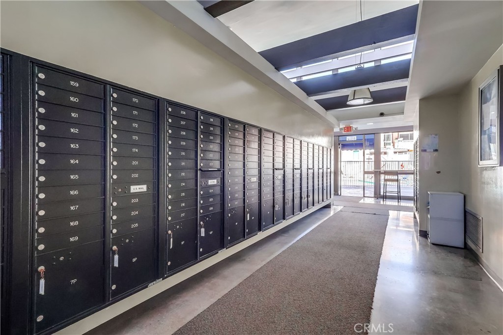5585 Pacific Coast Highway, Unit 140 Long Beach, CA 90804 - Photo 27 of 47 a view of a hallway with windows