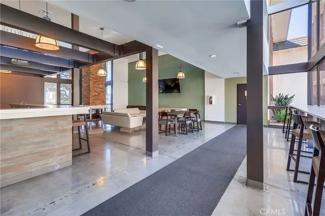 a lobby with furniture and floor to ceiling window