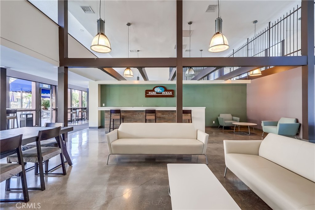 5585 Pacific Coast Highway, Unit 140 Long Beach, CA 90804 - Photo 31 of 47 a living room with furniture a ceiling fan and a large window