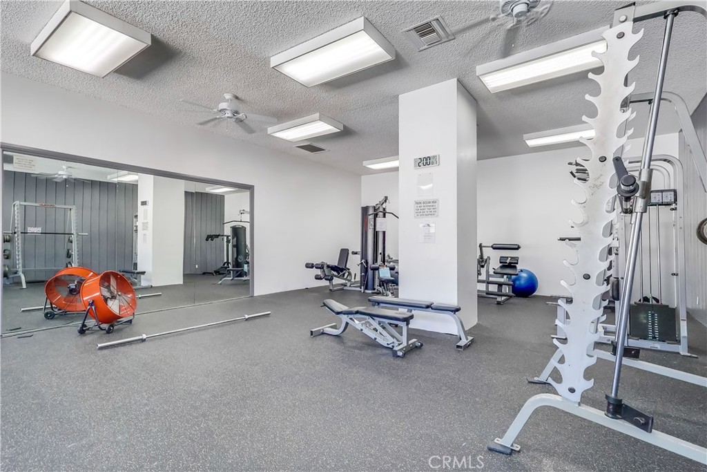 5585 Pacific Coast Highway, Unit 140 Long Beach, CA 90804 - Photo 34 of 47 a view of a room with gym equipment