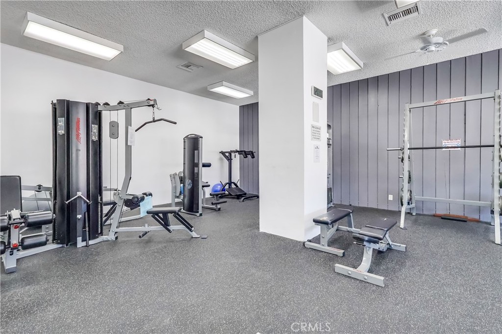 5585 Pacific Coast Highway, Unit 140 Long Beach, CA 90804 - Photo 35 of 47 a view of a room with gym equipment