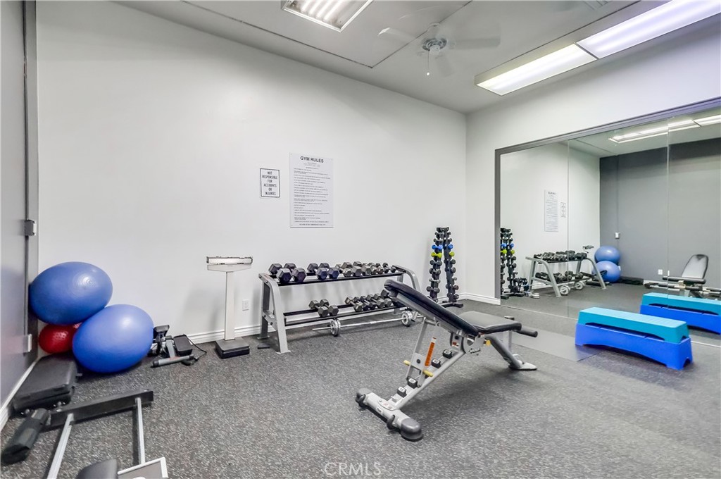 5585 Pacific Coast Highway, Unit 140 Long Beach, CA 90804 - Photo 38 of 47 a room with gym equipment