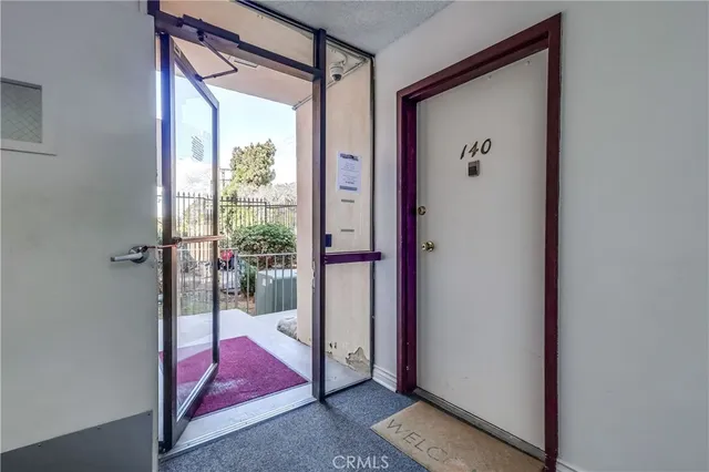 a view of front door and bedroom