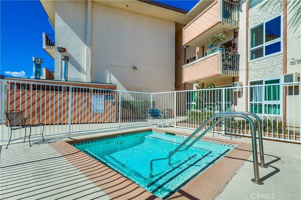 5585 Pacific Coast Highway, Unit 140 Long Beach, CA 90804 - Photo 43 of 47 a view of balcony with wooden floor and fence