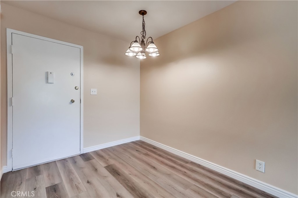 5585 Pacific Coast Highway, Unit 140 Long Beach, CA 90804 - Photo 10 of 47 wooden floor in an empty room