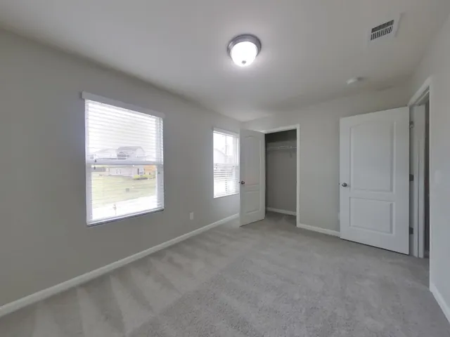 a bathroom with a sink a light fixture and a mirror