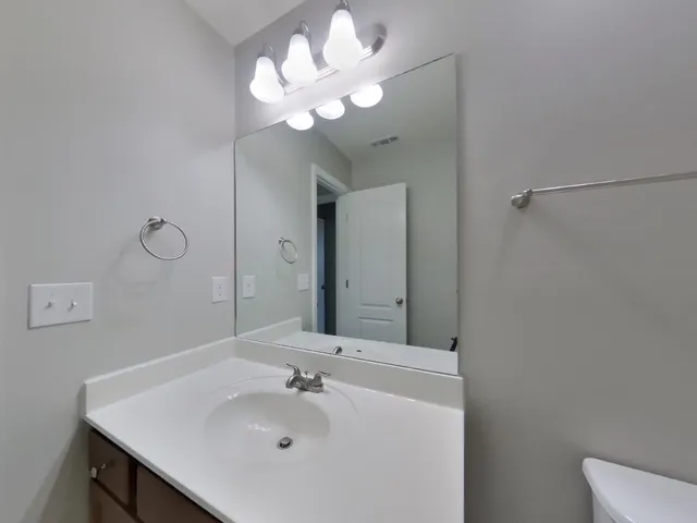a bathroom with a bathtub and a toilet