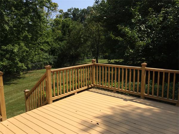 217 Morgan Road West Springfield, MA 01089 - Photo 23 of 25 a view of wooden deck and lake with trees in the background