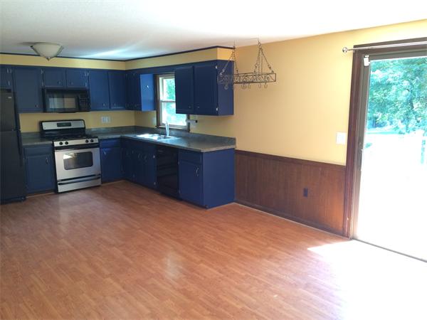 217 Morgan Road West Springfield, MA 01089 - Photo 4 of 25 a kitchen with stainless steel appliances granite countertop a refrigerator and a stove top oven