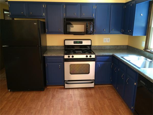 217 Morgan Road West Springfield, MA 01089 - Photo 6 of 25 a kitchen with a sink stove and refrigerator