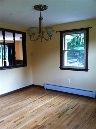 217 Morgan Road West Springfield, MA 01089 - Photo 7 of 25 a view of an empty room with wooden floor and a window