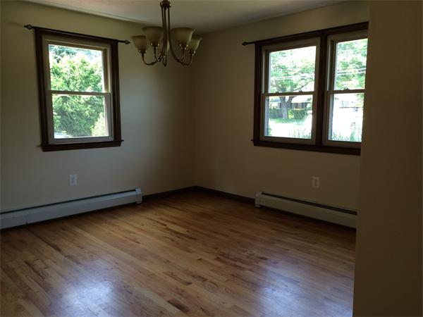 217 Morgan Road West Springfield, MA 01089 - Photo 8 of 25 an empty room with wooden floor and windows