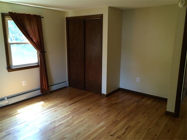 217 Morgan Road West Springfield, MA 01089 - Photo 9 of 25 an empty room with wooden floor and windows