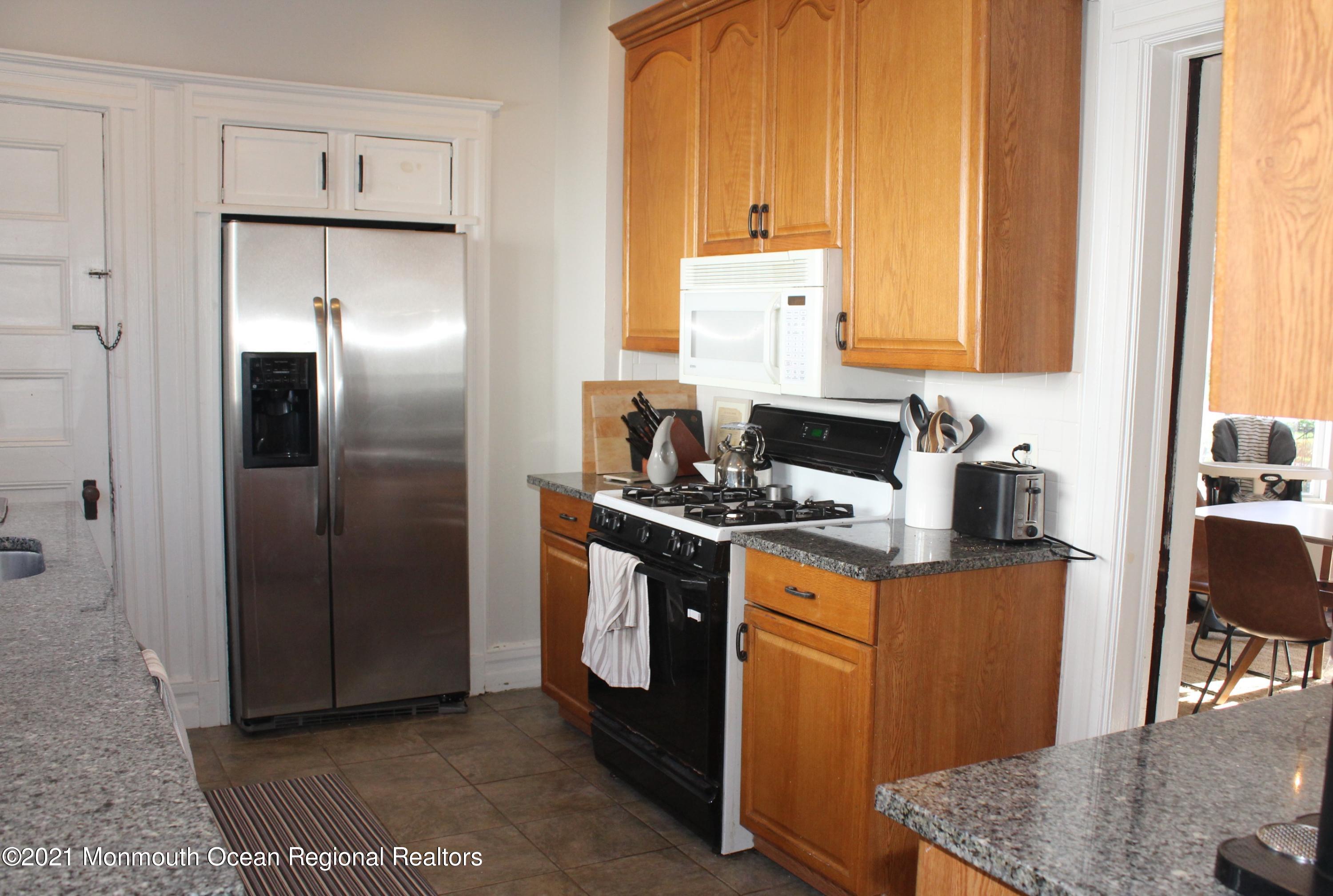 675 River Road Fair Haven, NJ 07704 - Photo 11 of 36 a kitchen with stainless steel appliances granite countertop a refrigerator stove and sink