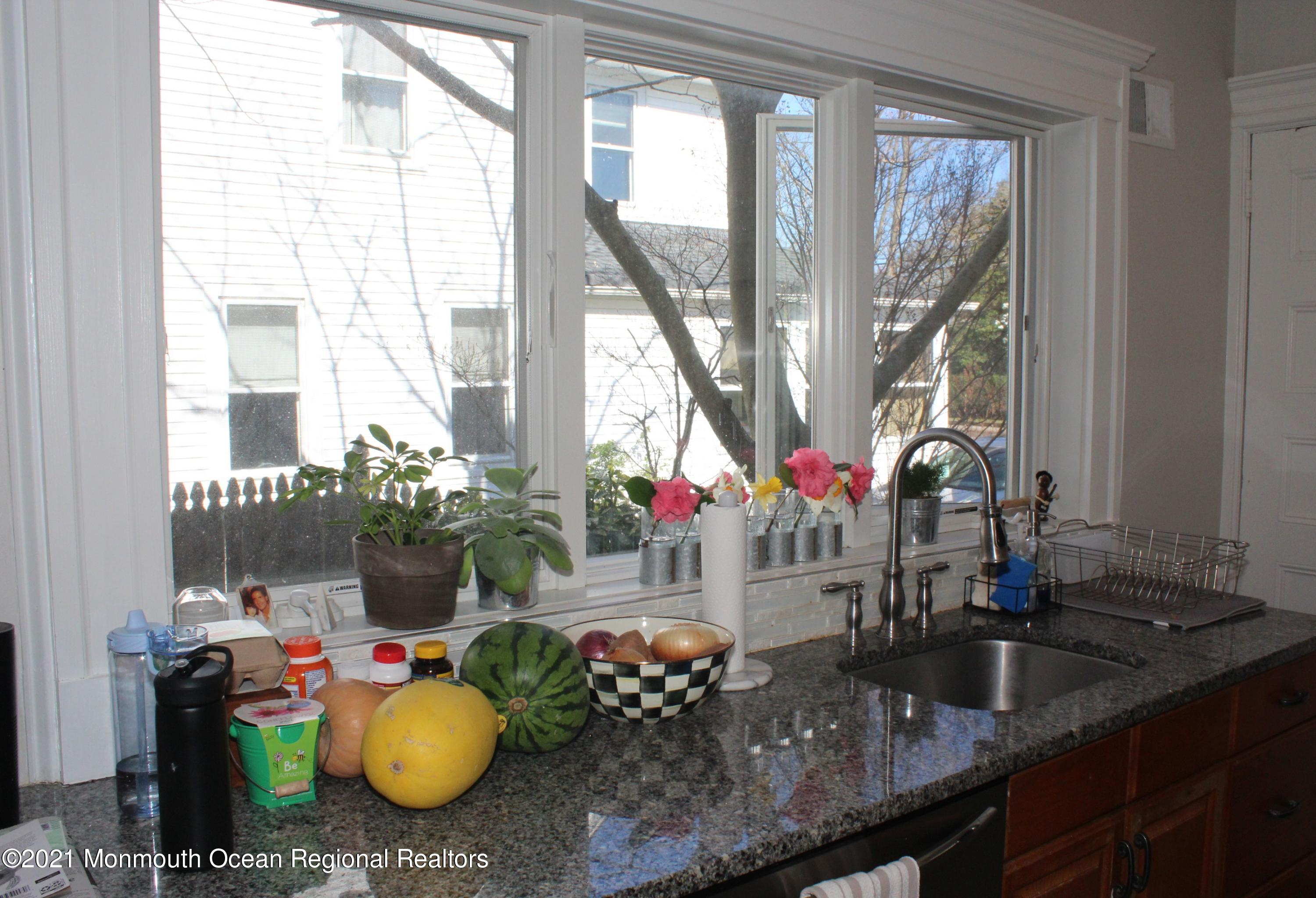 675 River Road Fair Haven, NJ 07704 - Photo 12 of 36 a table room with stainless steel appliances granite countertop a sink and a wooden cabinets