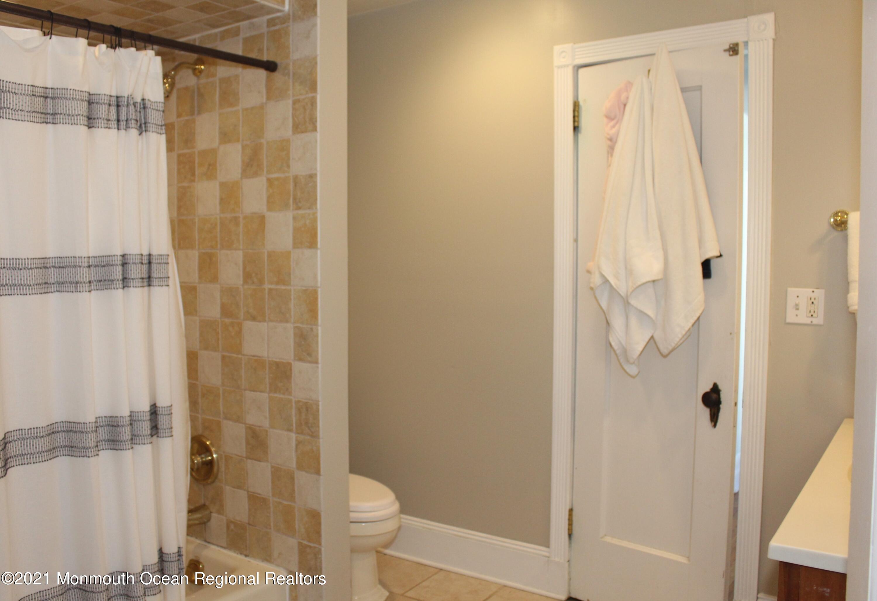 675 River Road Fair Haven, NJ 07704 - Photo 22 of 36 a bathroom with a shower and a toilet