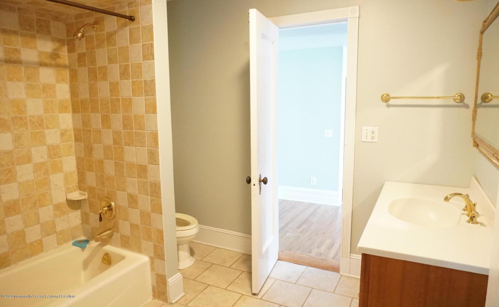 675 River Road Fair Haven, NJ 07704 - Photo 23 of 36 a bathroom with a sink and a shower