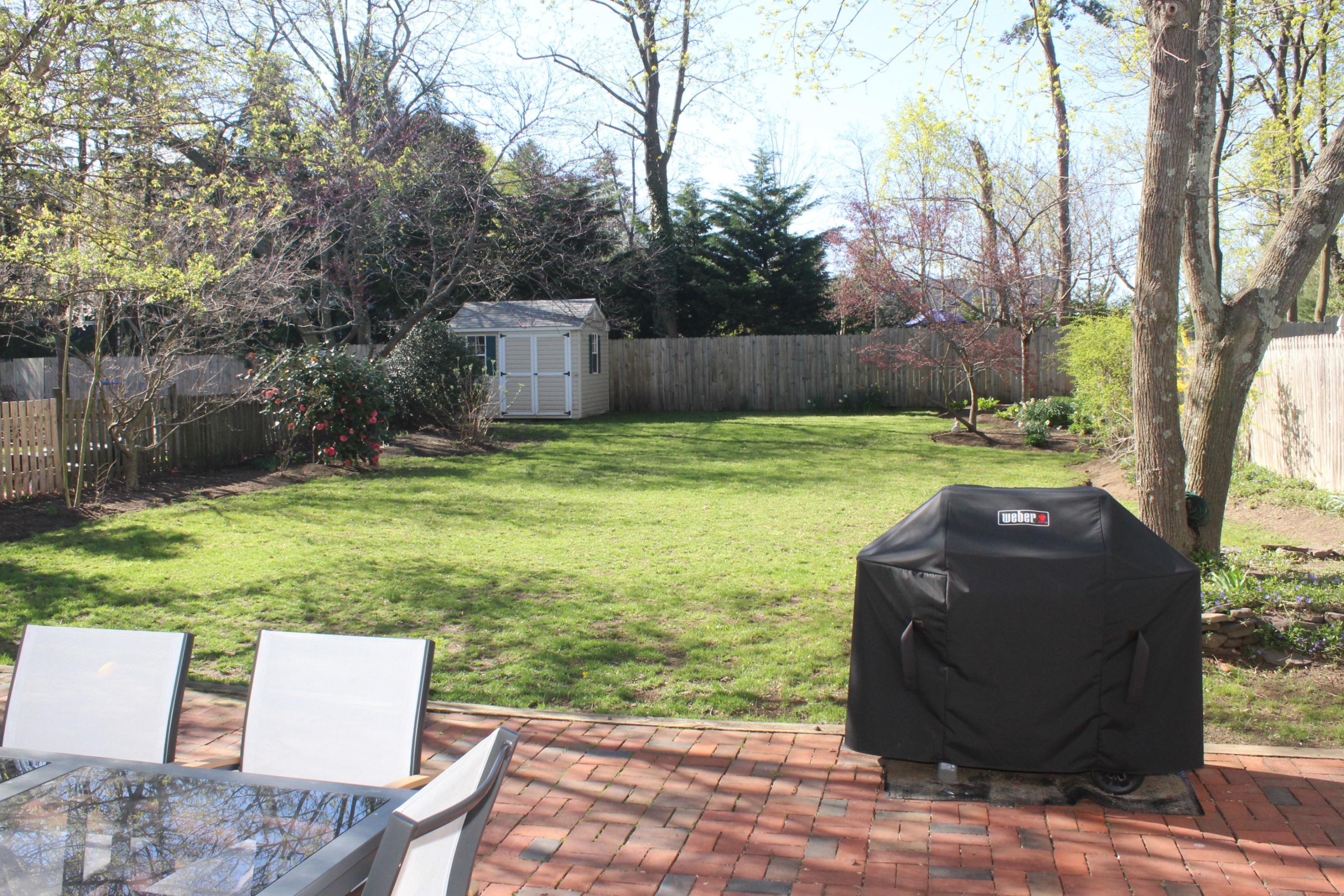 675 River Road Fair Haven, NJ 07704 - Photo 25 of 36 a backyard of a house with yard and outdoor seating
