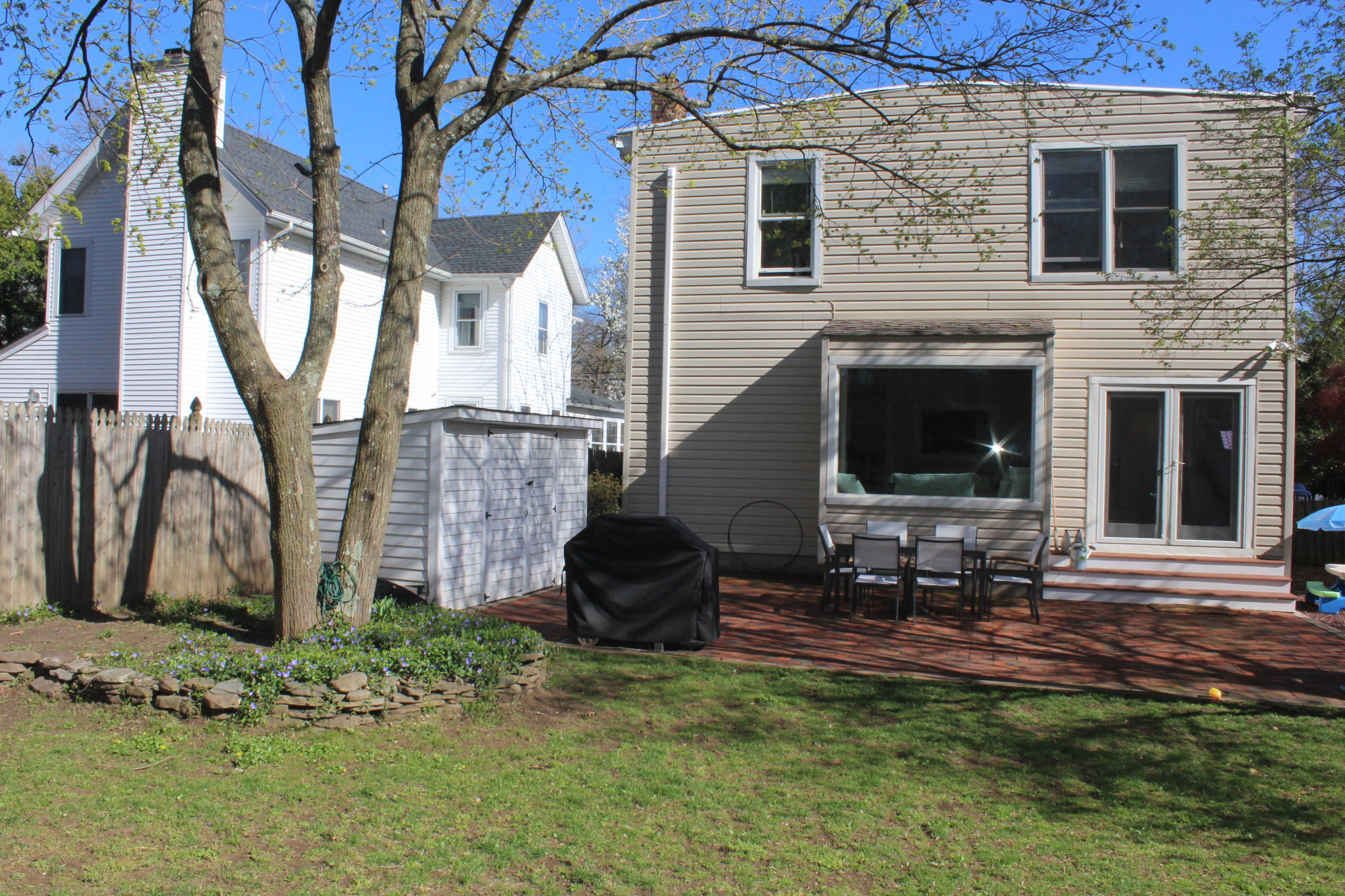 675 River Road Fair Haven, NJ 07704 - Photo 29 of 36 a view of backyard with outdoor seating and plants