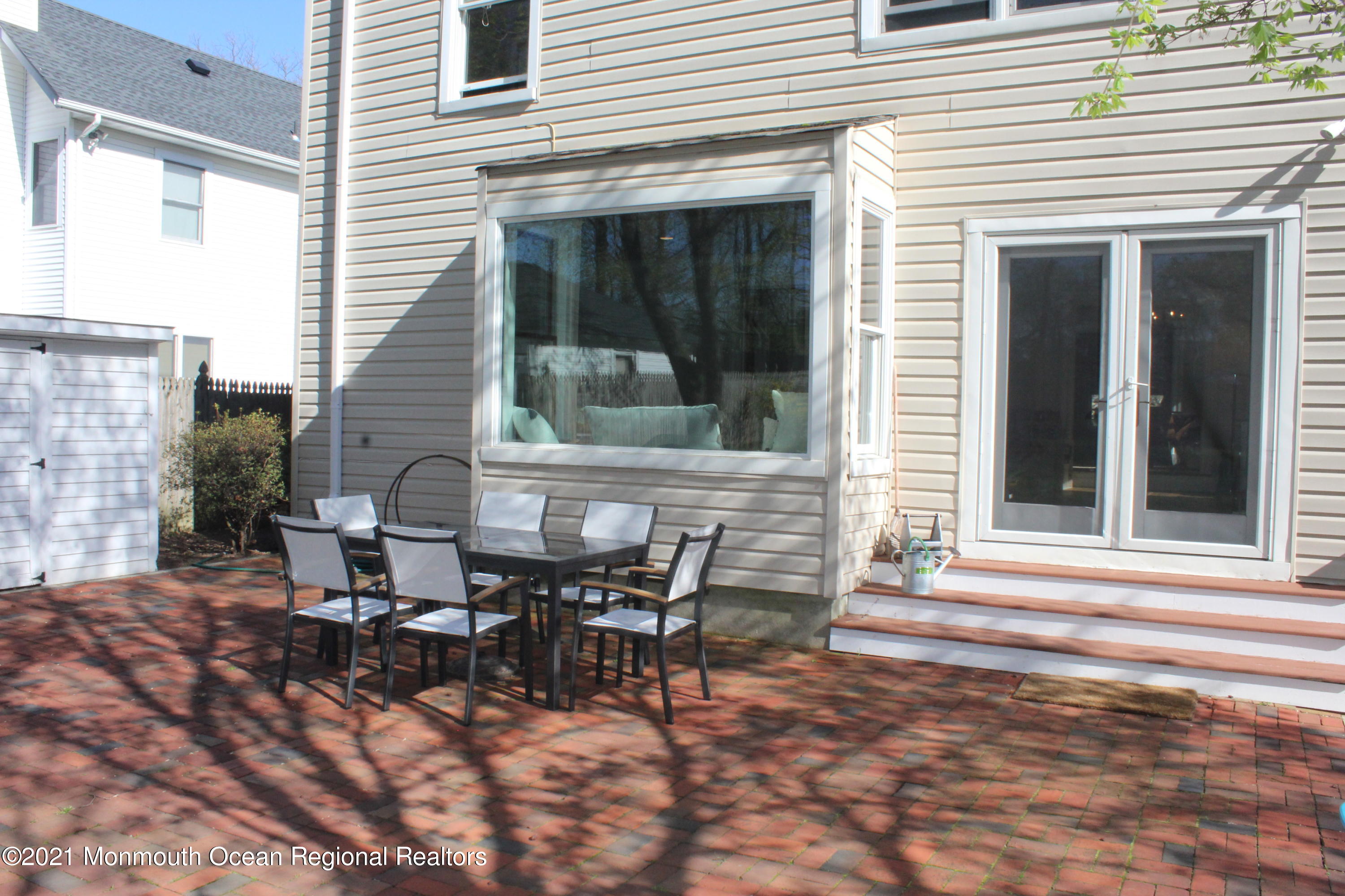 675 River Road Fair Haven, NJ 07704 - Photo 30 of 36 a view of a house with patio and a yard