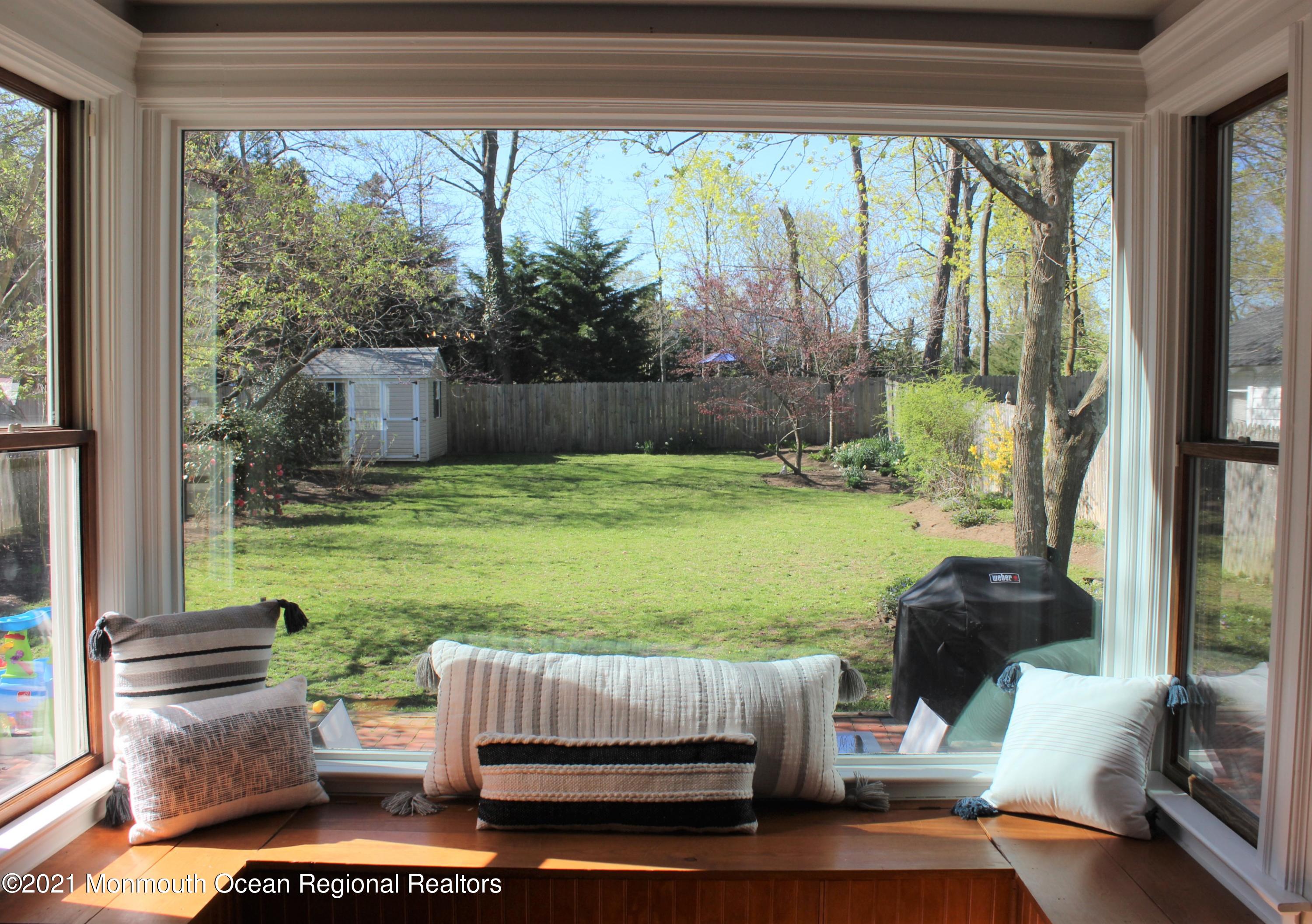 675 River Road Fair Haven, NJ 07704 - Photo 6 of 36 a living room with furniture and a floor to ceiling window