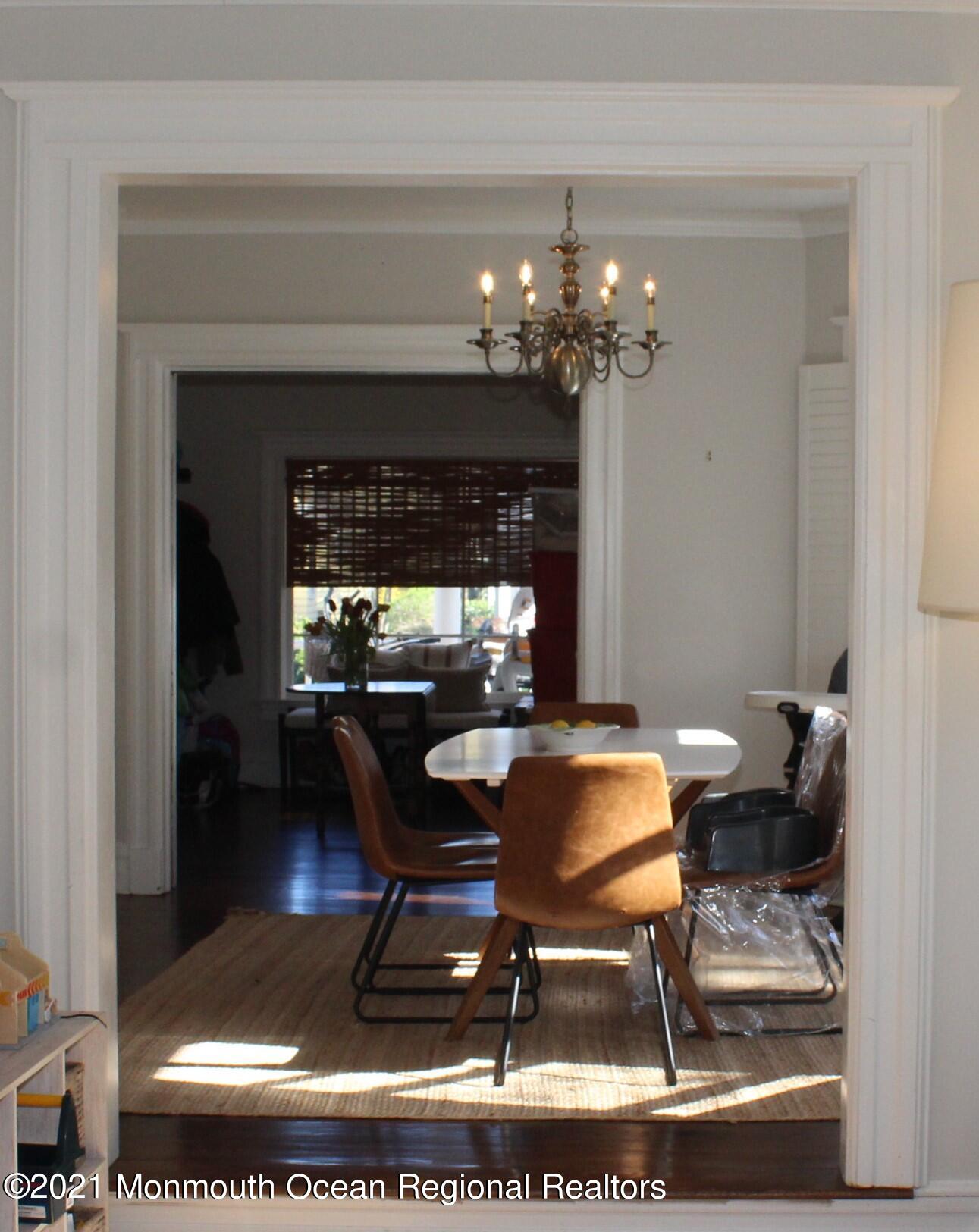 675 River Road Fair Haven, NJ 07704 - Photo 9 of 36 a dining room with furniture and chandelier