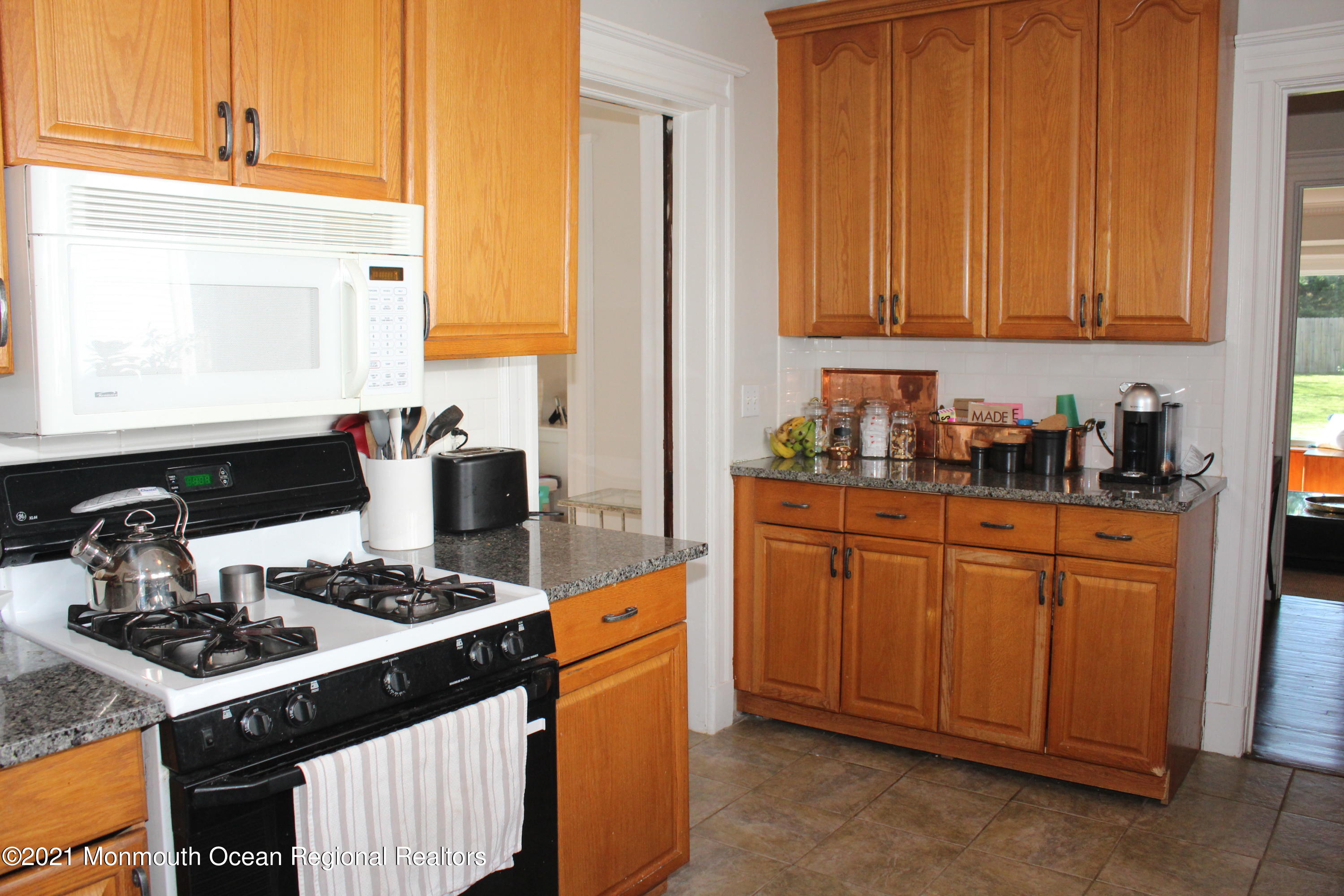 675 River Road Fair Haven, NJ 07704 - Photo 10 of 36 a kitchen with stainless steel appliances granite countertop a stove a sink dishwasher and cabinets with wooden floor