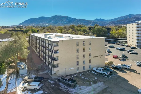 a view of a terrace with a table and chairs