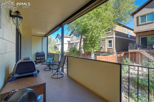 a balcony with chairs
