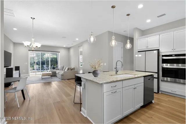 a open kitchen with sink cabinets and stainless steel appliances