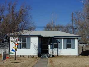 4202 South Tyler Street Amarillo, TX 79110 - Photo 1 of 1 a front view of a house with a yard