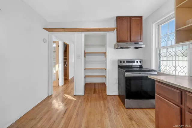 a kitchen with stainless steel appliances a stove and a refrigerator